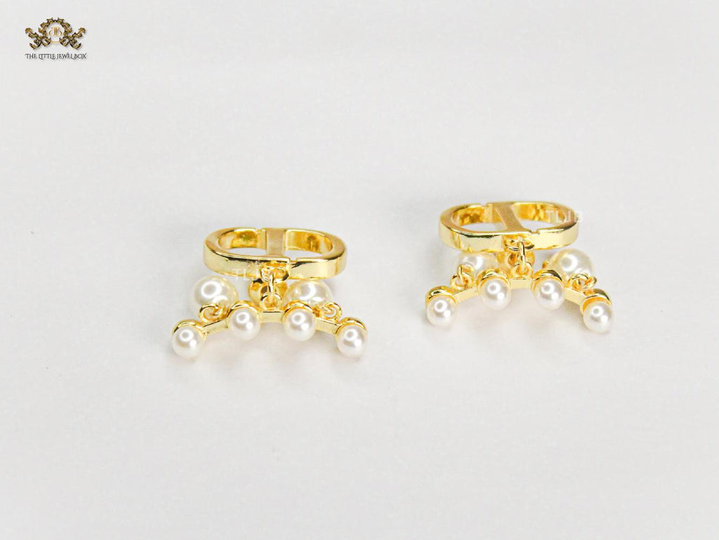 Alphabet C & D gold toned studs with pearl charms