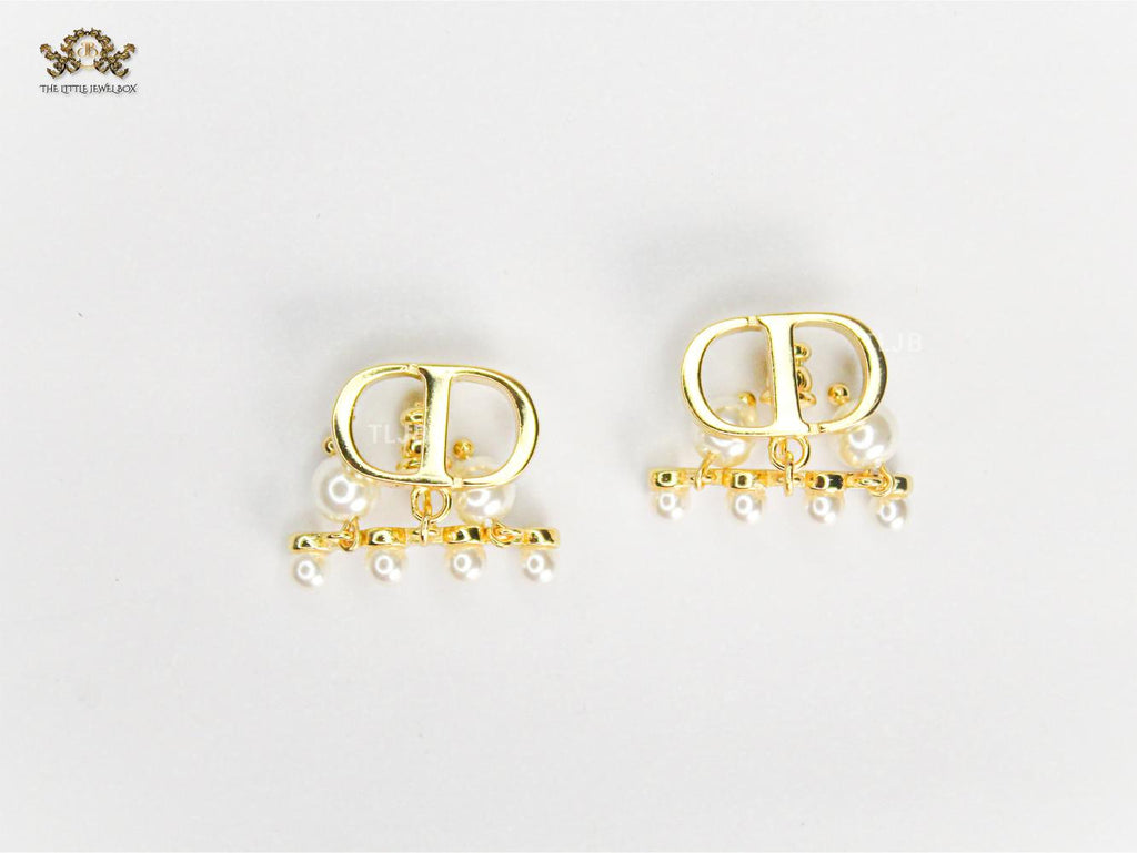 Alphabet C & D gold toned studs with pearl charms