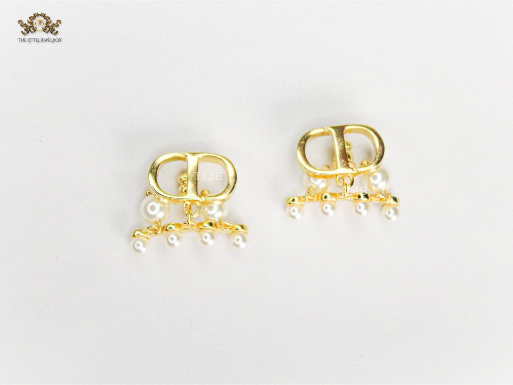 Alphabet C & D gold toned studs with pearl charms