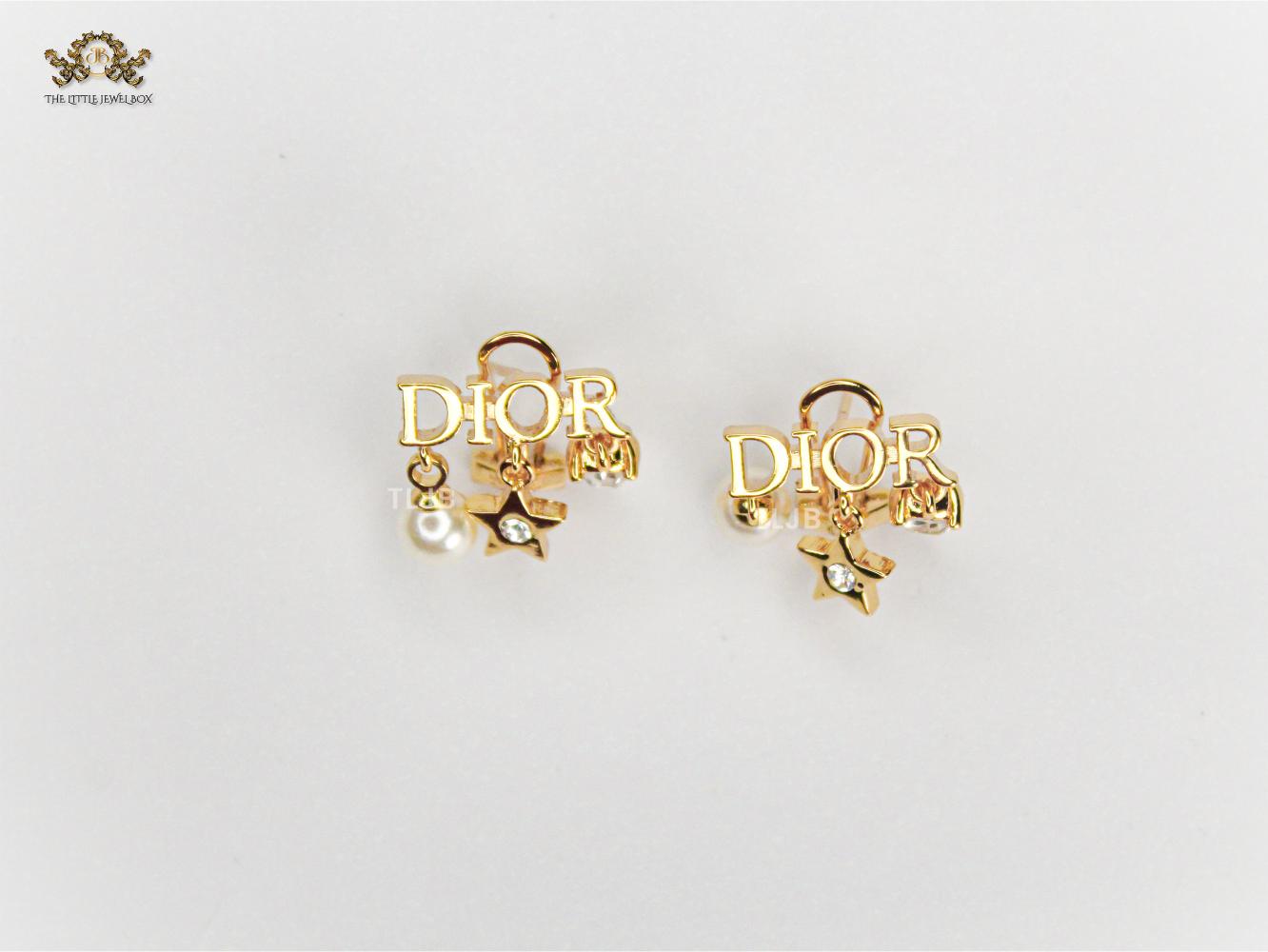 Alphabet D  mini charmed earrings in gold