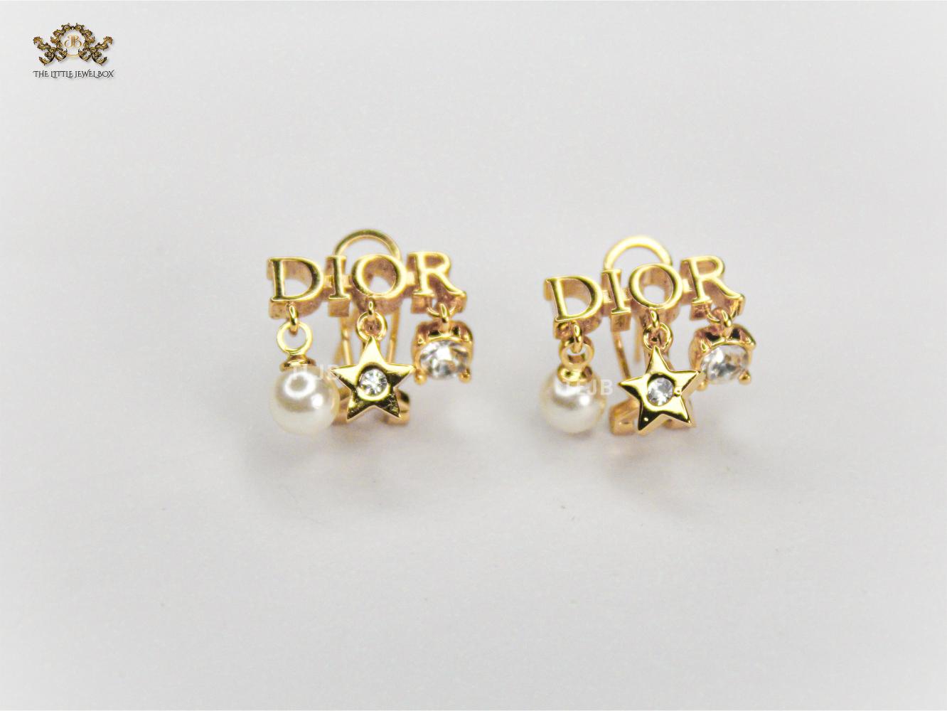 Alphabet D  mini charmed earrings in gold