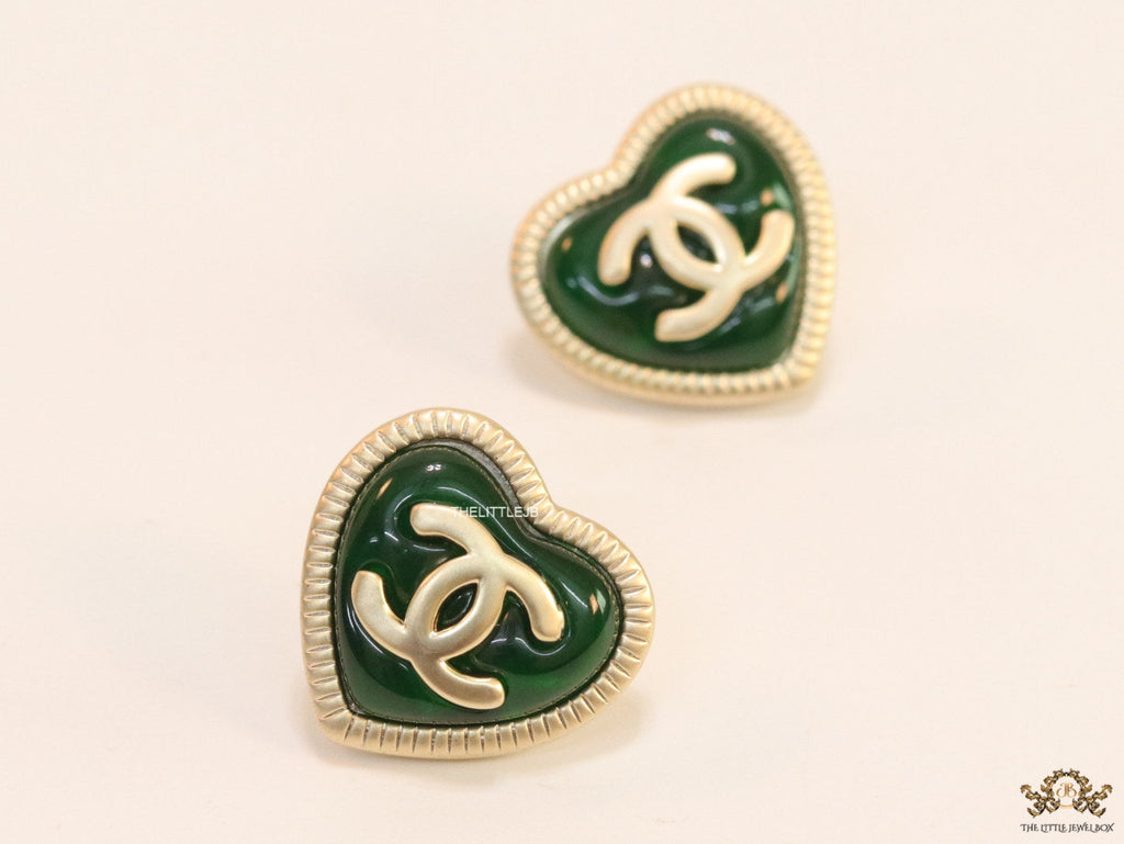 Heart shape twin C motif golden studs with deep green base