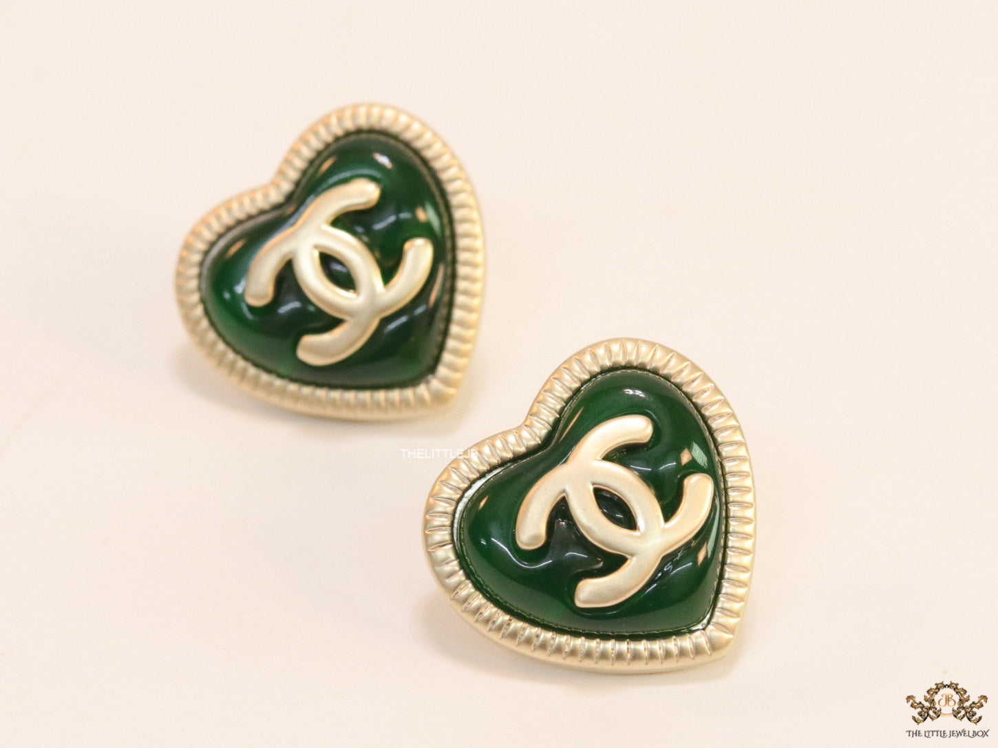 Heart shape twin C motif golden studs with deep green base