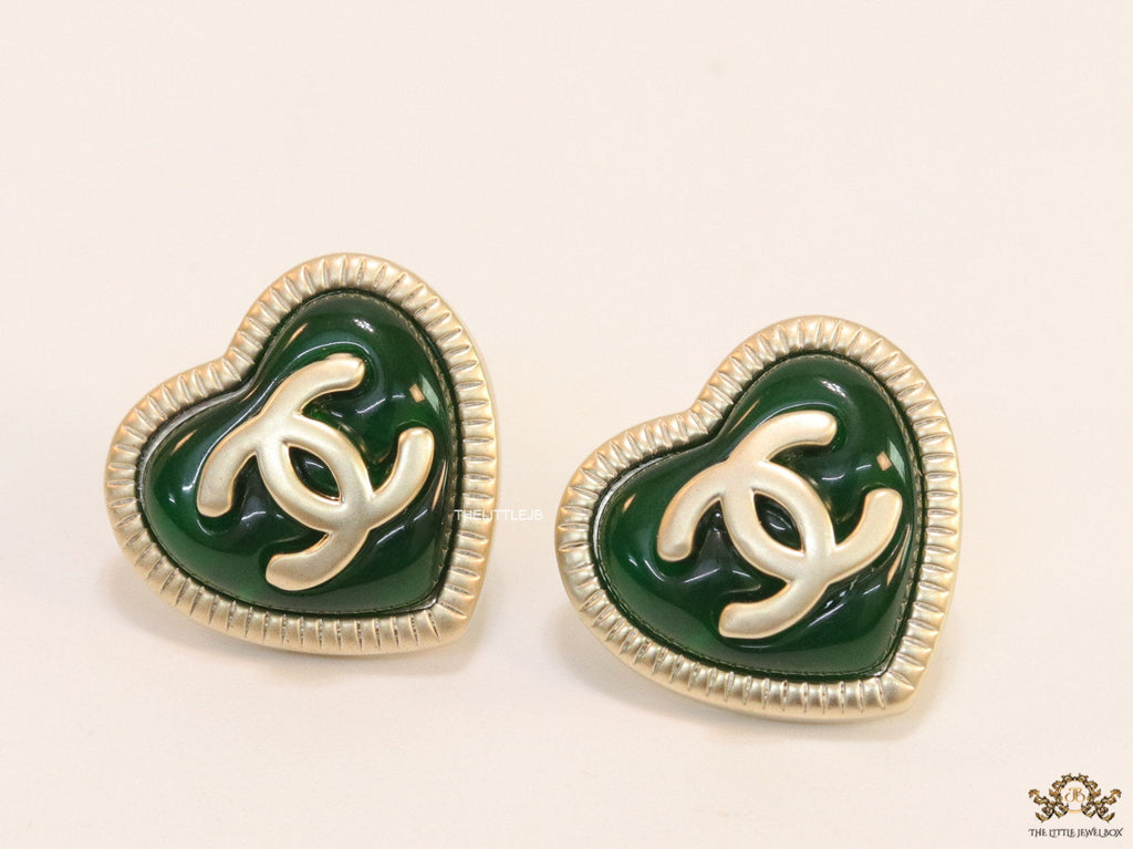 Heart shape twin C motif golden studs with deep green base