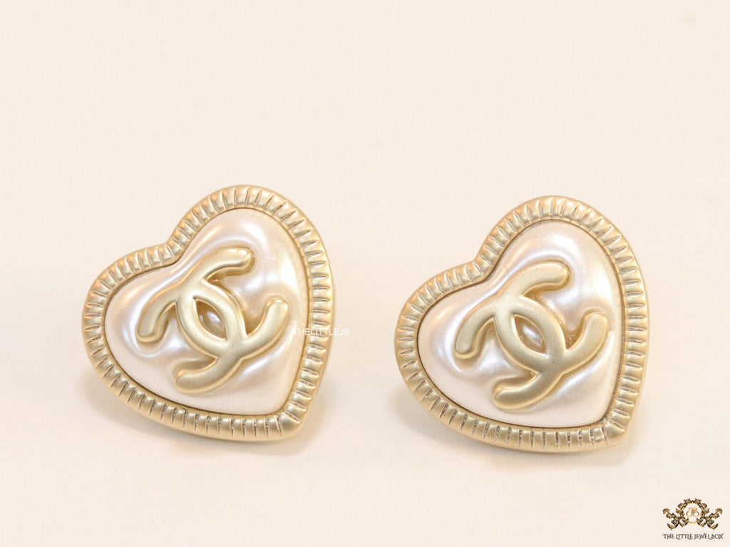 Heart shape twin C motif golden studs with pearl base