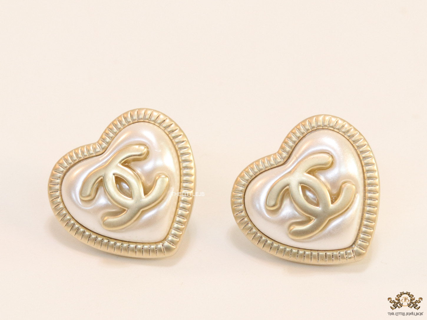Heart shape twin C motif golden studs with pearl base