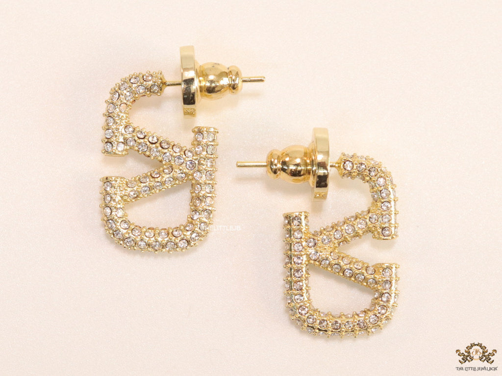Golden cz alphabet studs with letter V