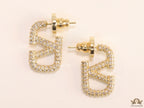Golden cz alphabet studs with letter V