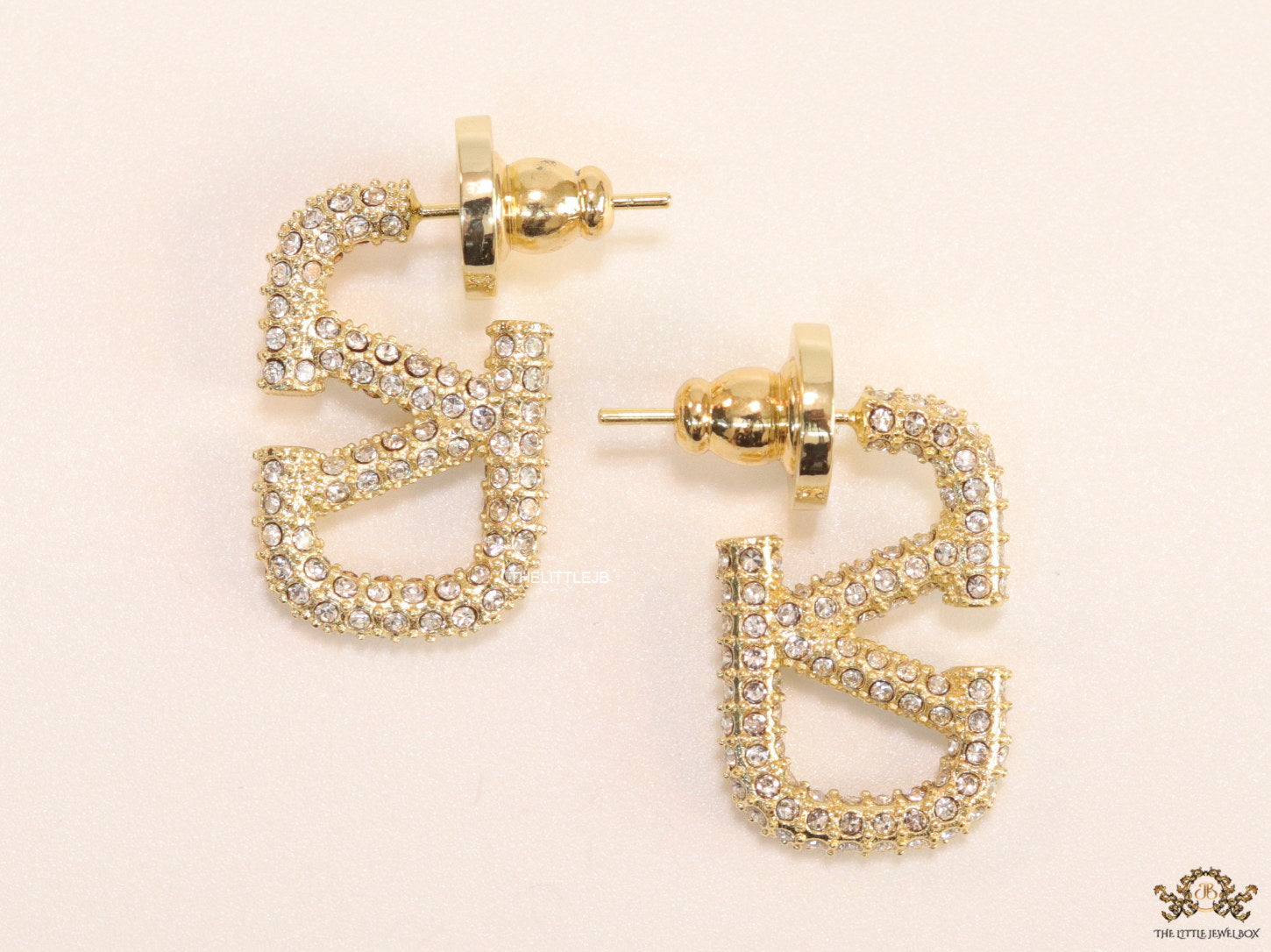 Golden cz alphabet studs with letter V