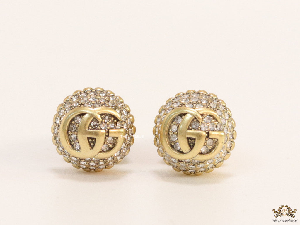 Gold plated cz softy shape studs with twin G motif