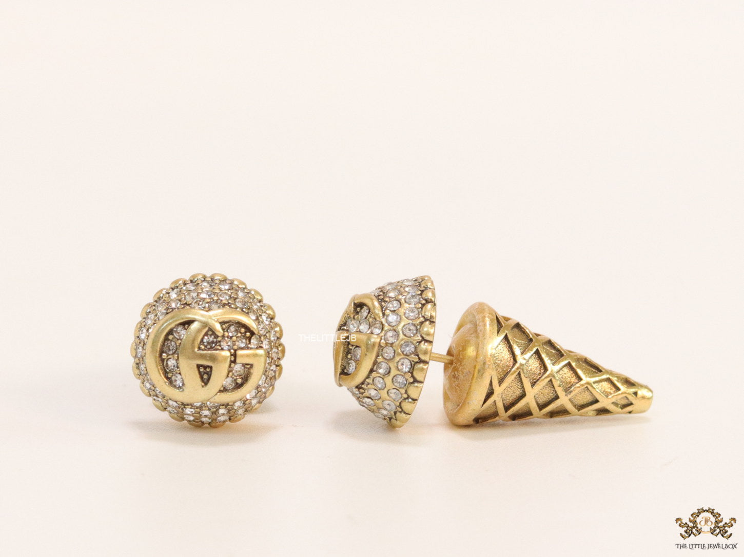 Gold plated cz softy shape studs with twin G motif