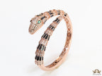 Top open serpentine black enamel bracelet with rose gold plating and cubic zirconia stones