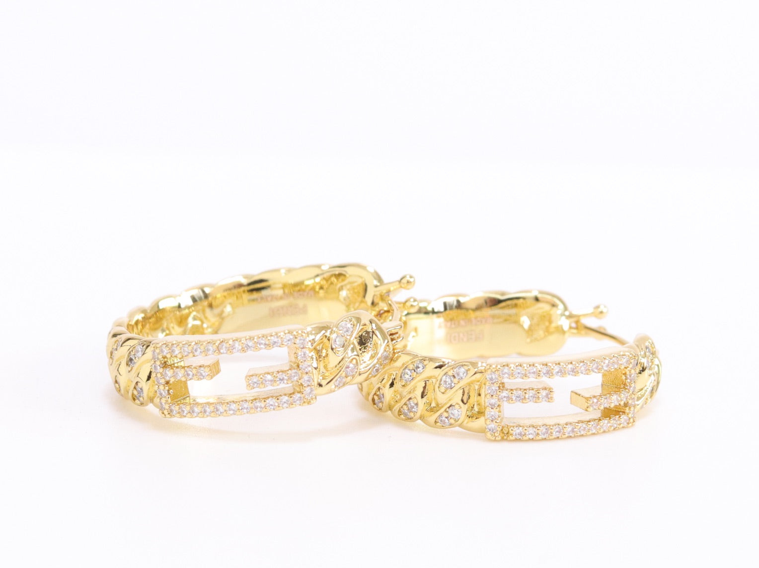 Double F hoops in gold finish with cz