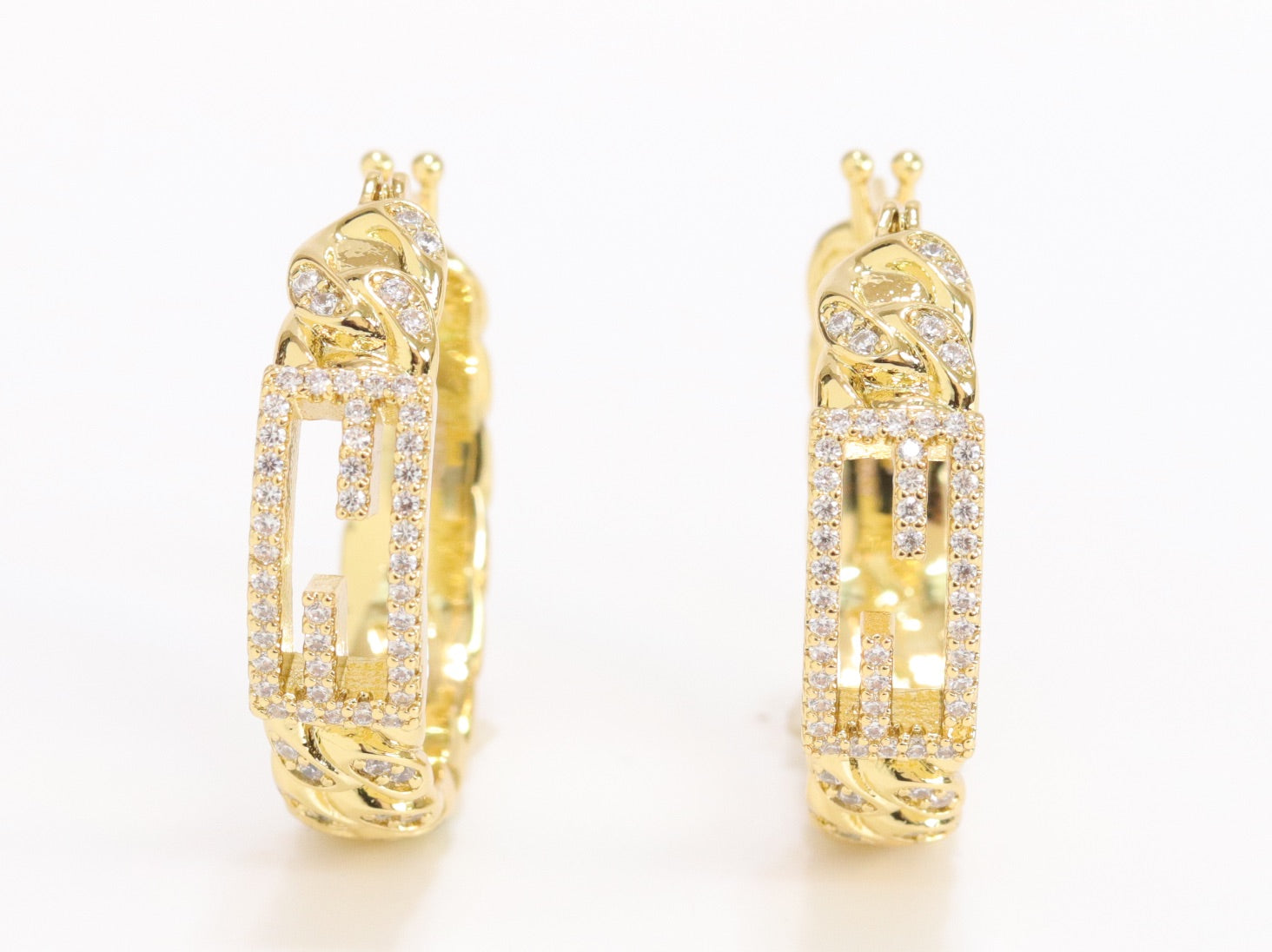 Double F hoops in gold finish with cz