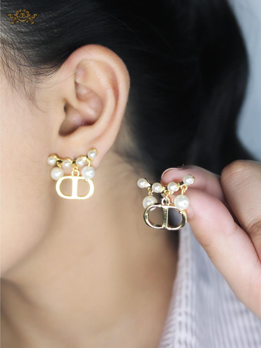 Alphabet C & D gold toned studs with pearl charms