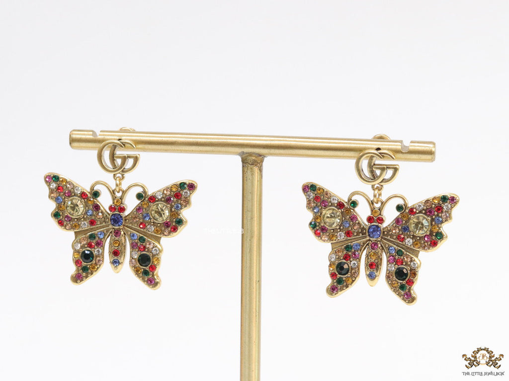 Gold plated twin G motif earrings with multi cz butterfly drops