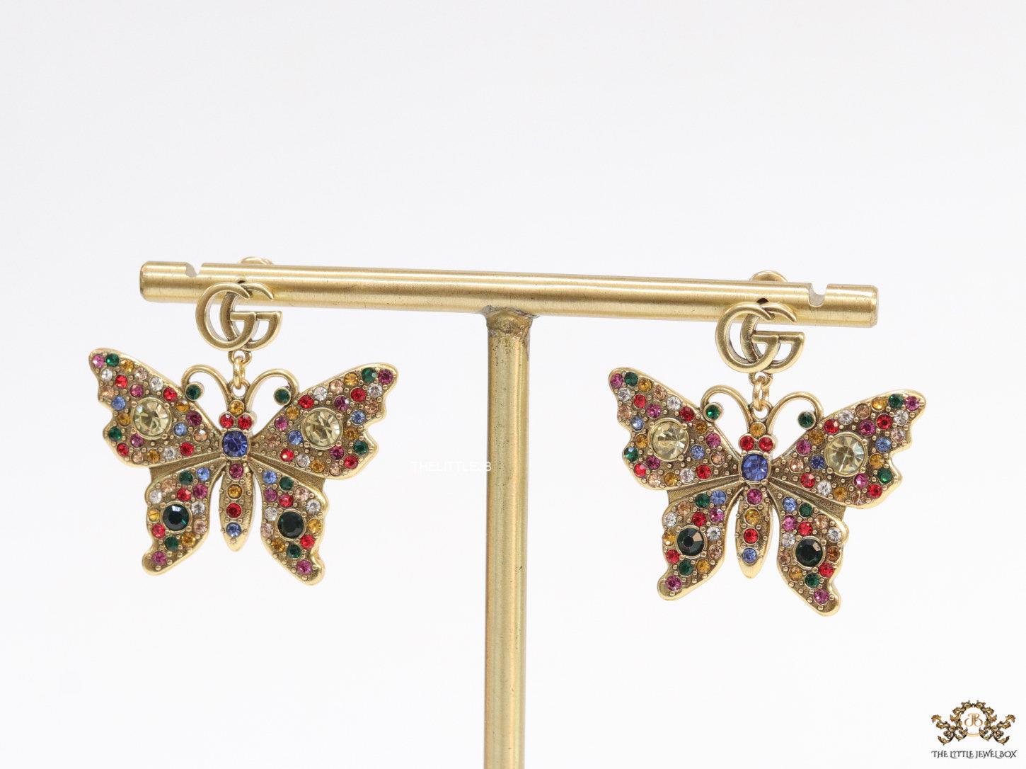 Gold plated twin G motif earrings with multi cz butterfly drops