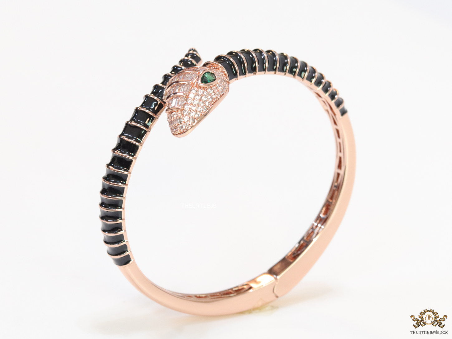 Top open serpentine bracelet in black enamel with rose gold plated details and cubic zirconia stones head