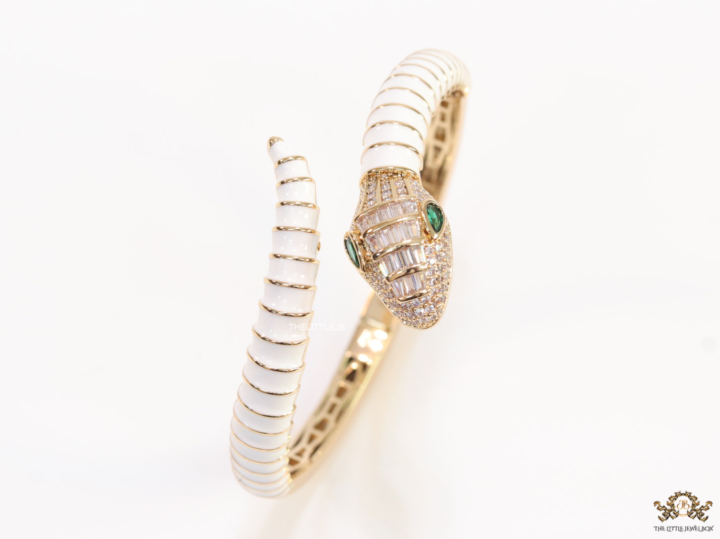 Top open snake bracelet in white enamel with rose gold plated details and cubic zirconia stones head