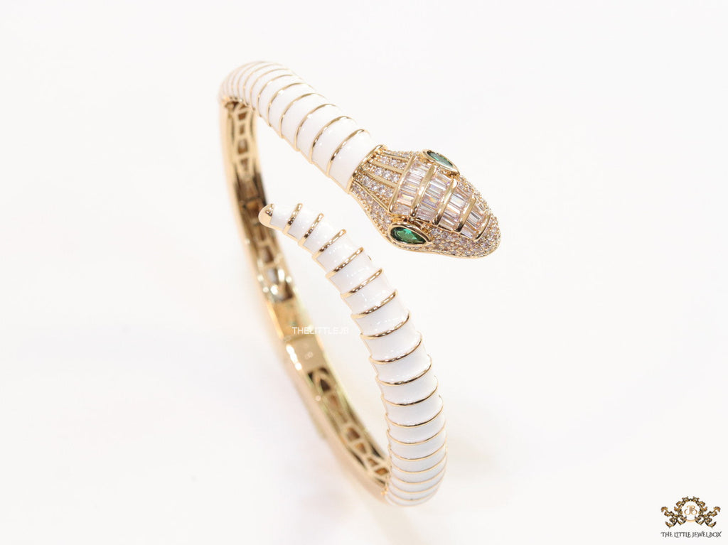 Top open snake bracelet in white enamel with rose gold plated details and cubic zirconia stones head