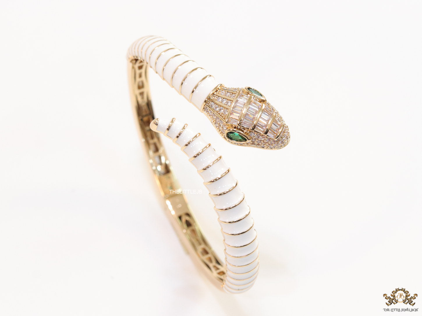 Top open snake bracelet in white enamel with rose gold plated details and cubic zirconia stones head