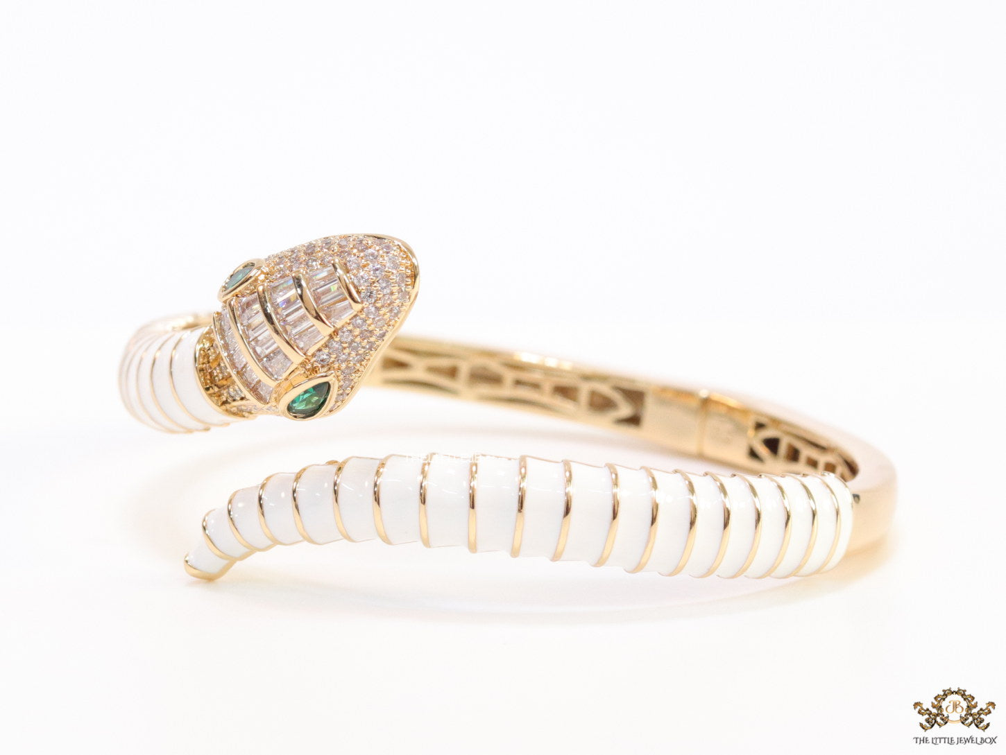 Top open serpentine bracelet in white enamel with rose gold plated details and cubic zirconia stones head