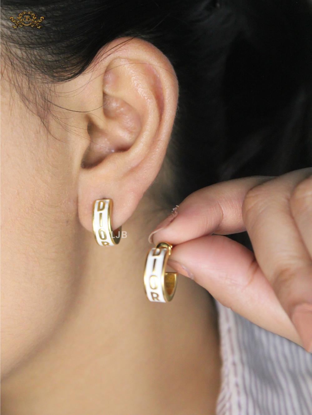 Alphabet D white hoops with gold detailing