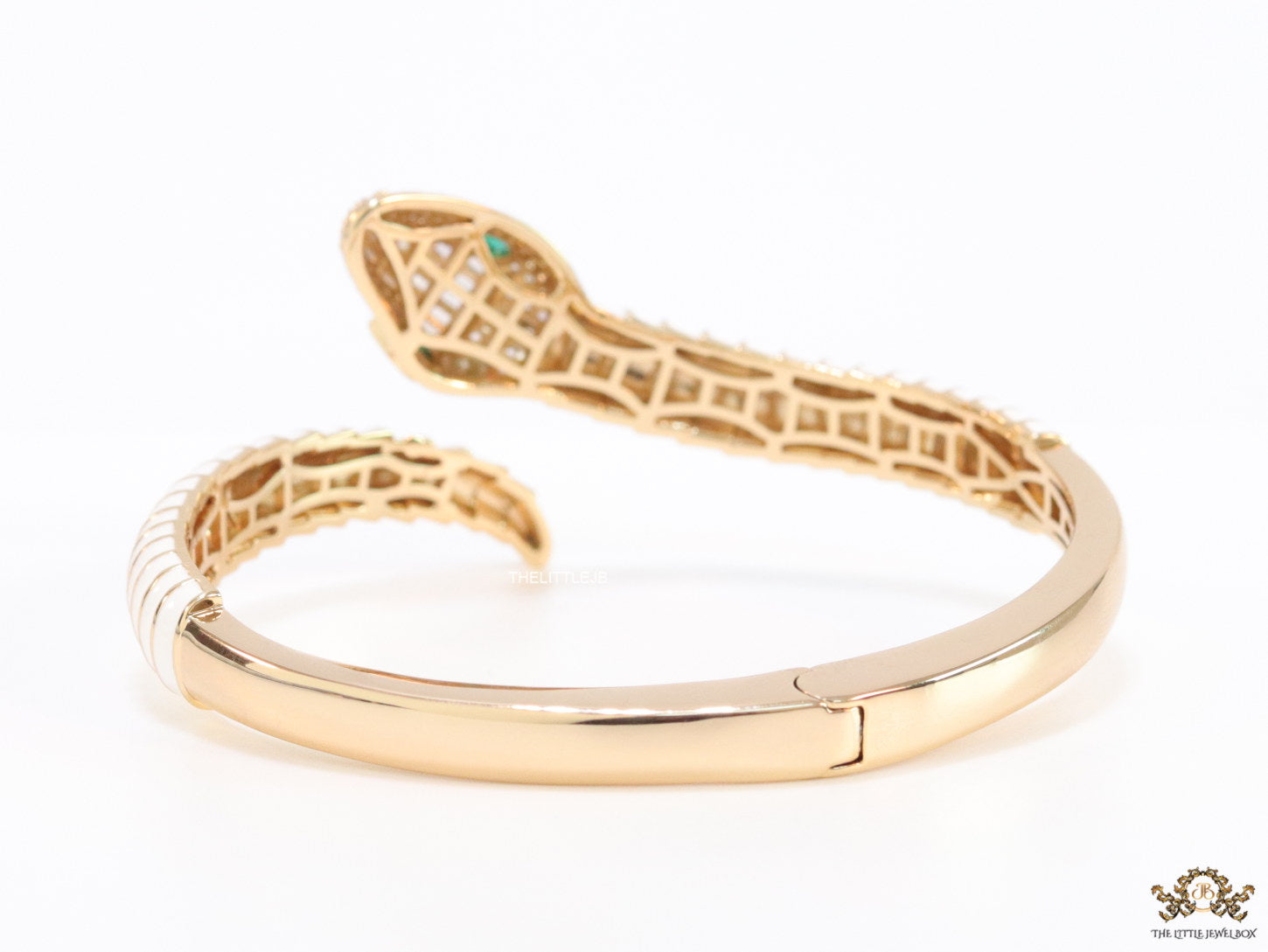 Top open serpentine bracelet in white enamel with rose gold plated details and cubic zirconia stones head