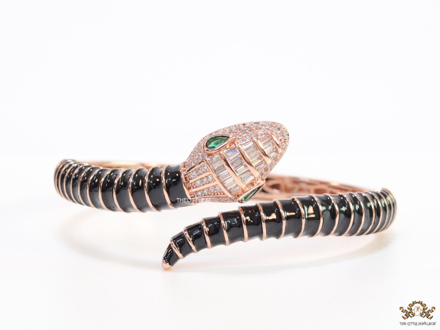 Top open serpentine bracelet in black enamel with rose gold plated details and cubic zirconia stones head