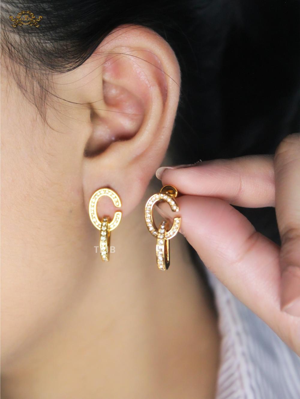 Alphabet D drop earrings in gold