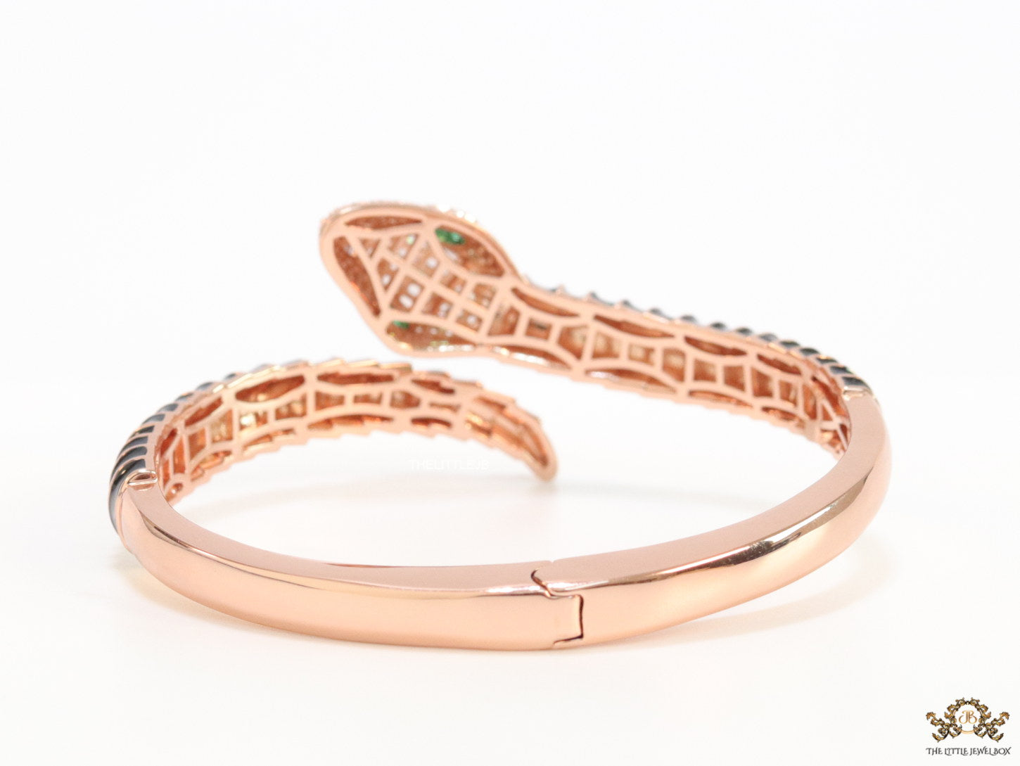 Top open serpentine bracelet in black enamel with rose gold plated details and cubic zirconia stones head