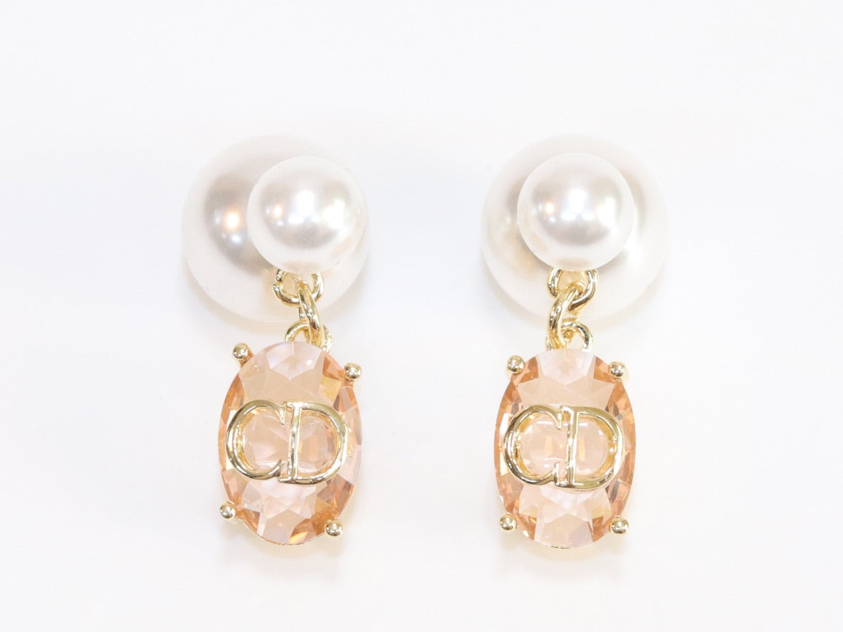 Alphabet C and D dangling baby pink stone pearl studs in rose gold finish
