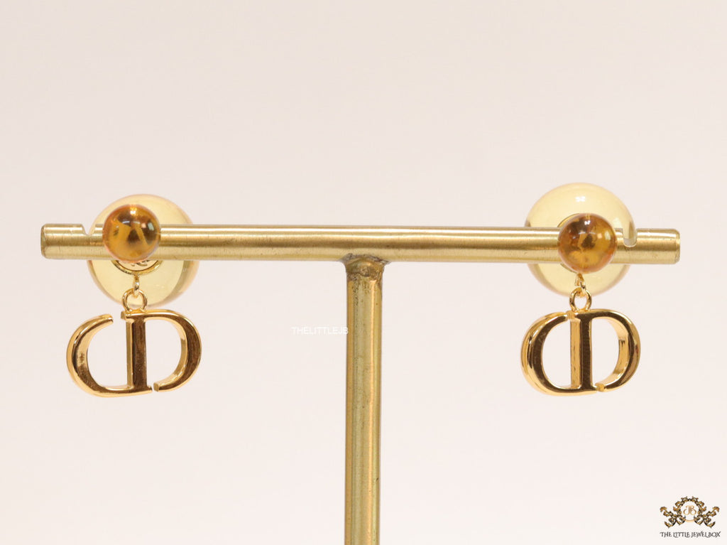 Golden pearl bomber earrings with alphabet initial drops