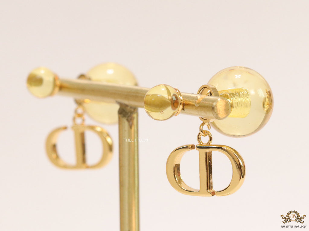 Golden pearl bomber earrings with alphabet initial drops