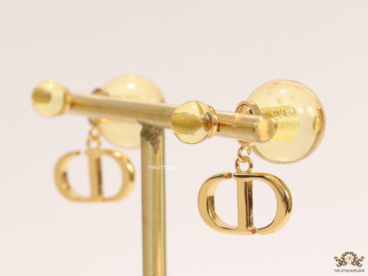 Golden pearl bomber earrings with alphabet initial drops