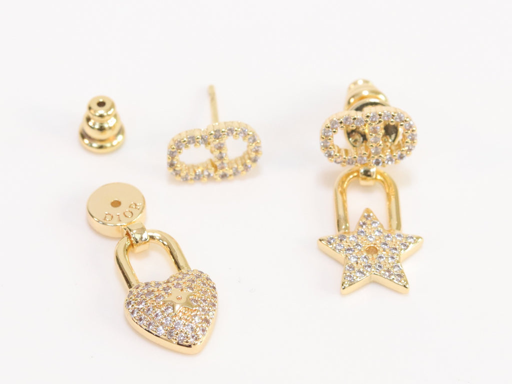 Alphabet C and D lock and star dangling stud in gold finish with cz