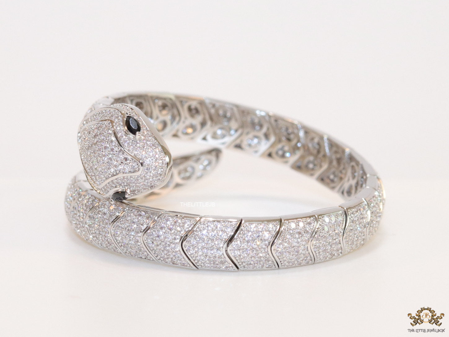 Cubic zirconia stones serpentine bracelet with platinum plated details black cubic zirconia stone details