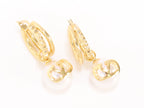 Alphabet V pearl dangling studs in gold finish