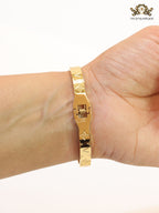 Embossed gold bracelet