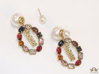 Gold plated pearl bomber earrings with multi cz motif and designer initials
