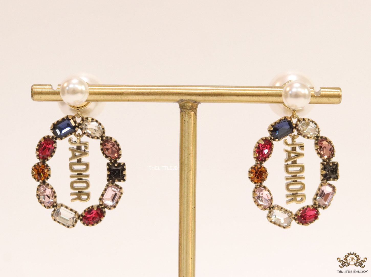 Gold plated pearl bomber earrings with multi cz motif and designer initials