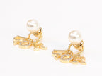 Alphabet CD dangling pearl studs in gold finish with CZ