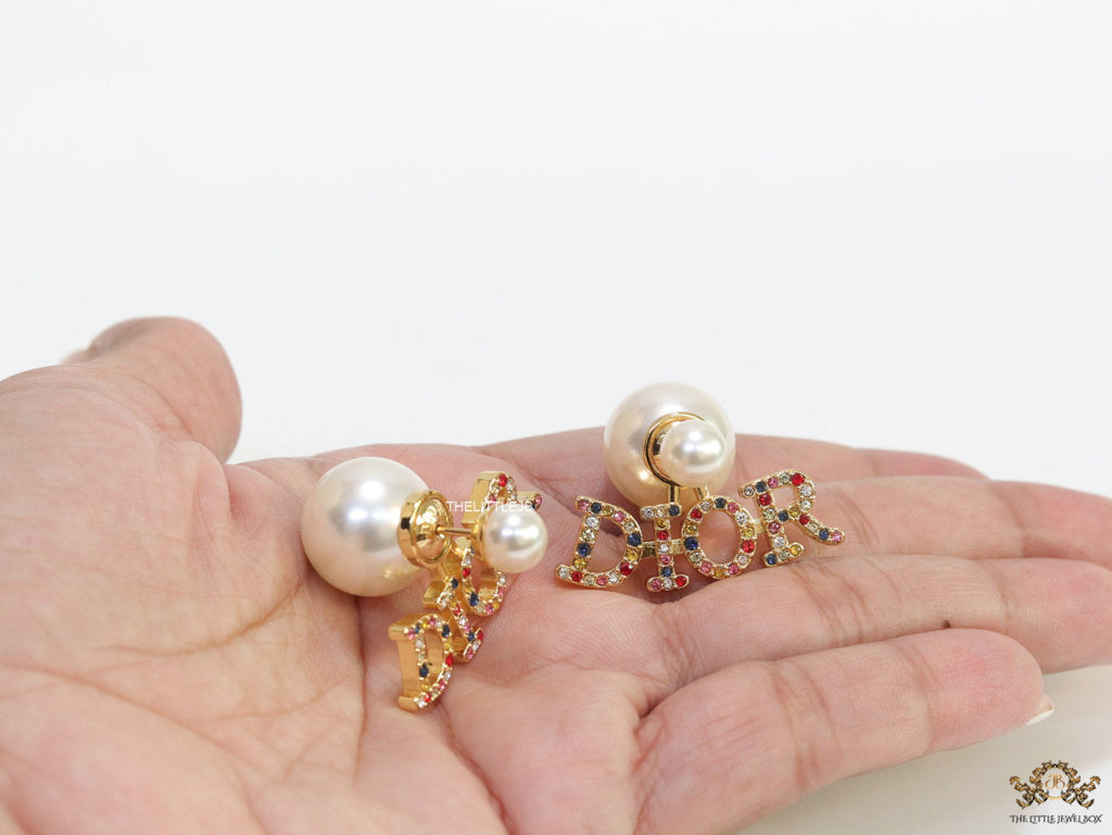 Pearl bomber earrings with golden and multi cz alphabet drop charms