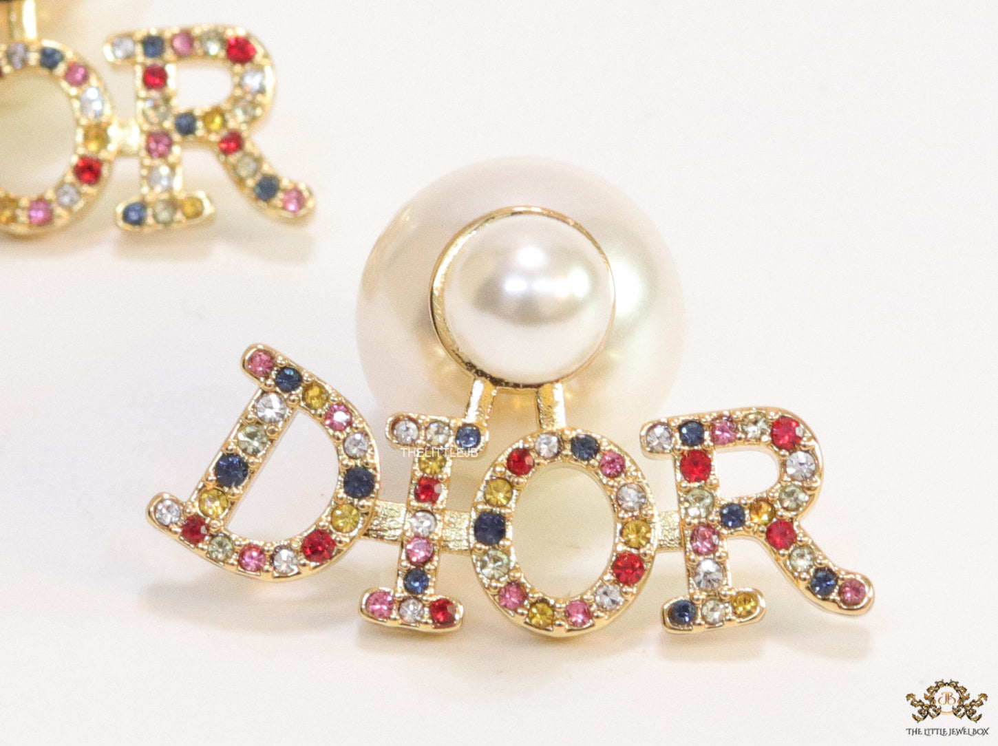 Pearl bomber earrings with golden and multi cz alphabet drop charms