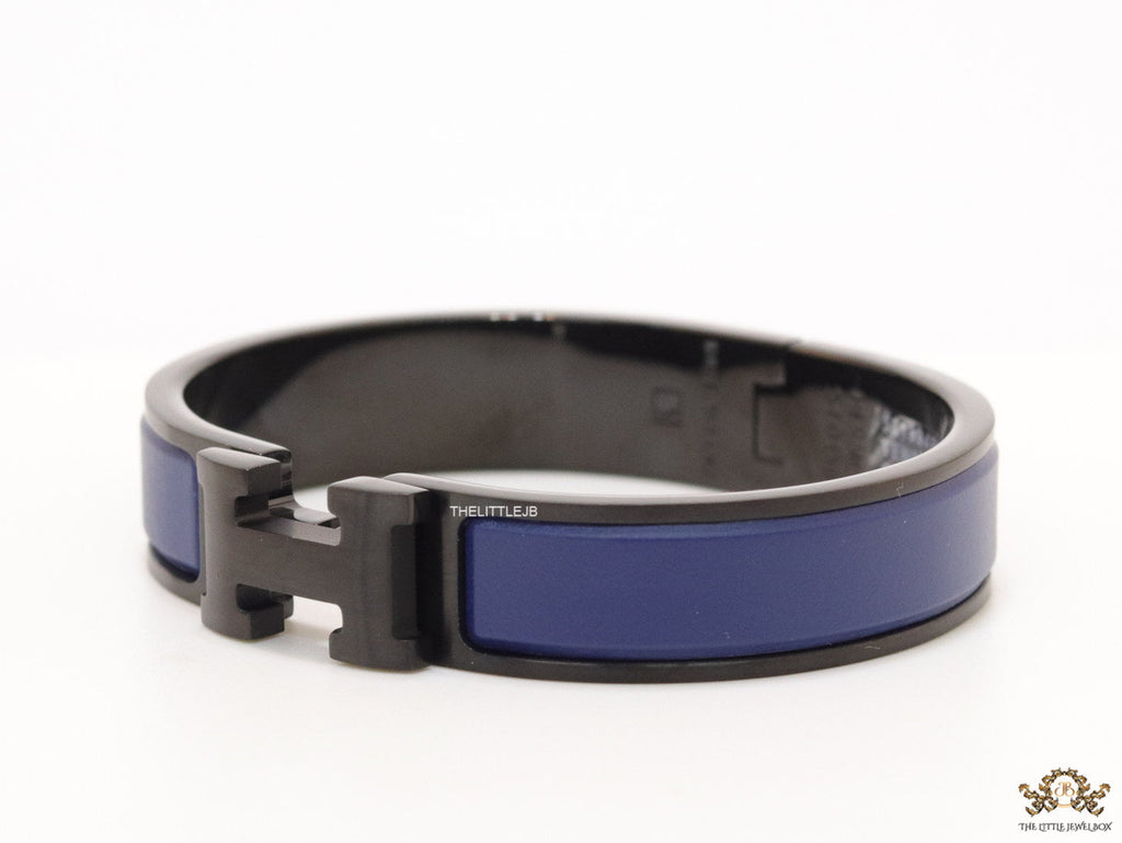 Premium collection band style bracelet in matt blue with black metallic details and black T alphabet motif