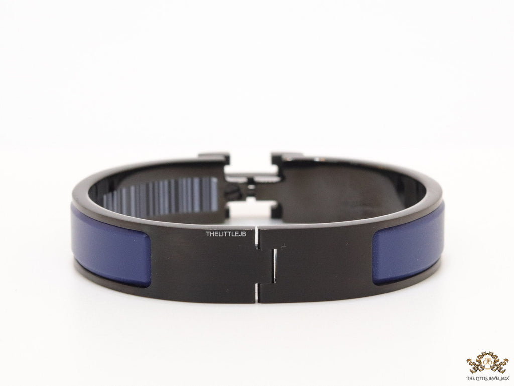 Premium collection band style bracelet in matt blue with black metallic details and black T alphabet motif