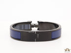 Premium collection band style bracelet in matt blue with black metallic details and black T alphabet motif
