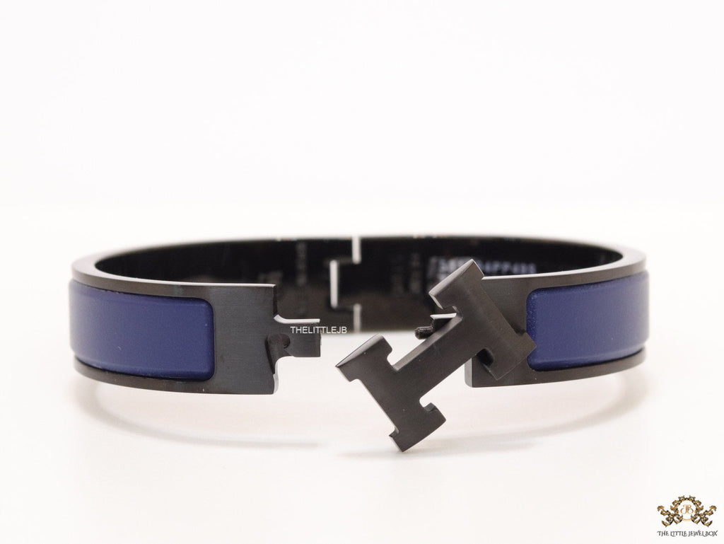 Premium collection band style bracelet in matt blue with black metallic details and black T alphabet motif