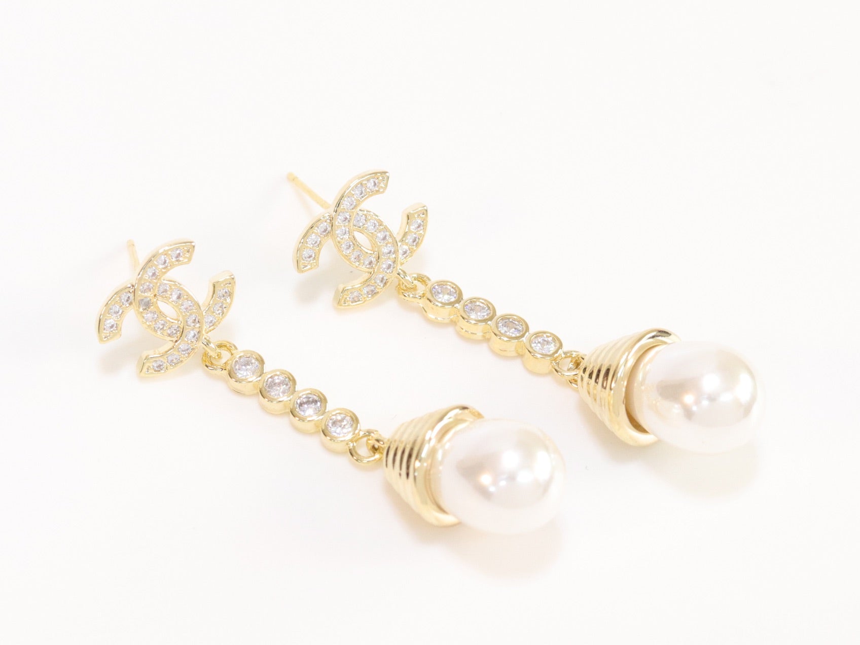 Double C long dangling earrings with pearls in gold finish