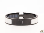 Premium collection band style bracelet in matt white with black metallic details and black T alphabet motif